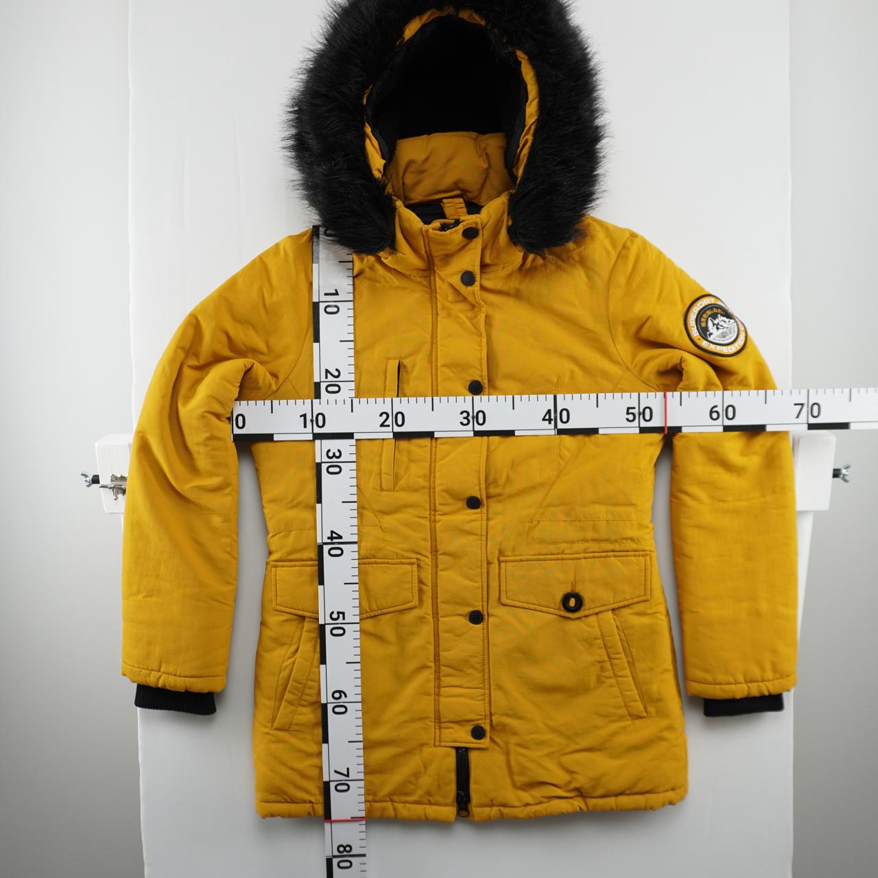 Parka de mujer Superdry. Amarillo. M. Usado. Bien