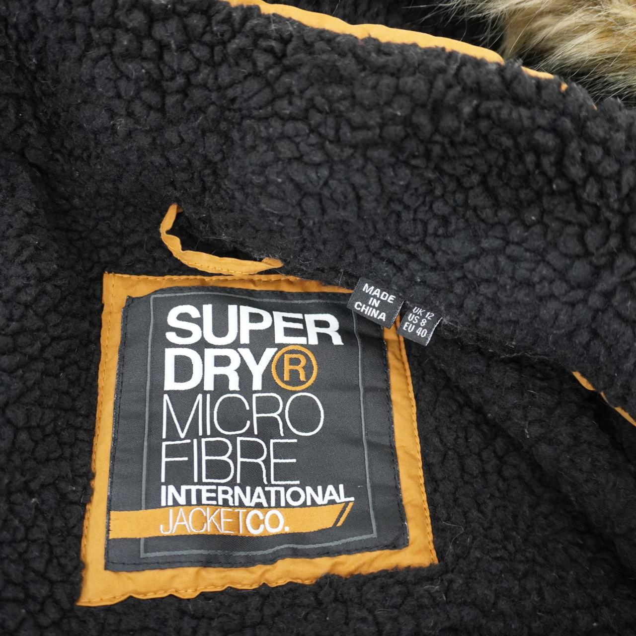 Parka Superdry para mujer. Naranja. Talla L. Usada. En buen estado.