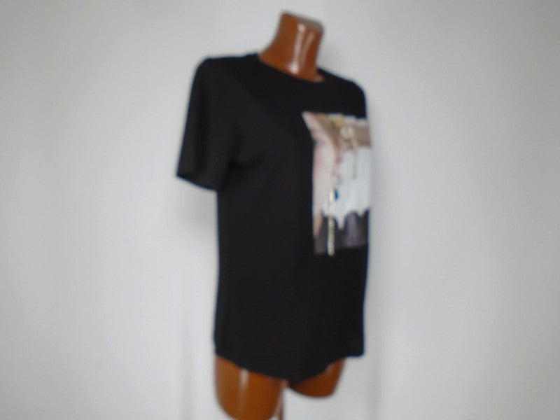 Camiseta Mujer MD. De color negro. Tamaño: S.